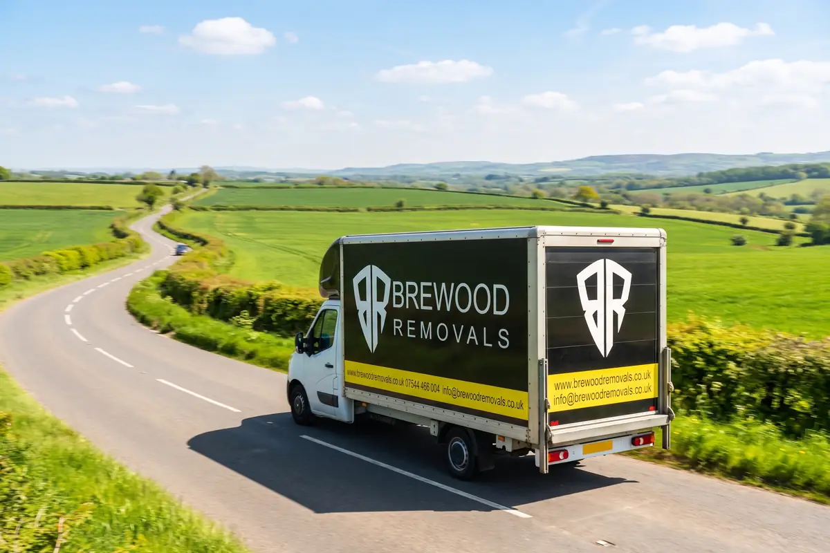 Two branded Brewood Removals box vans on the road, ready for a business relocation