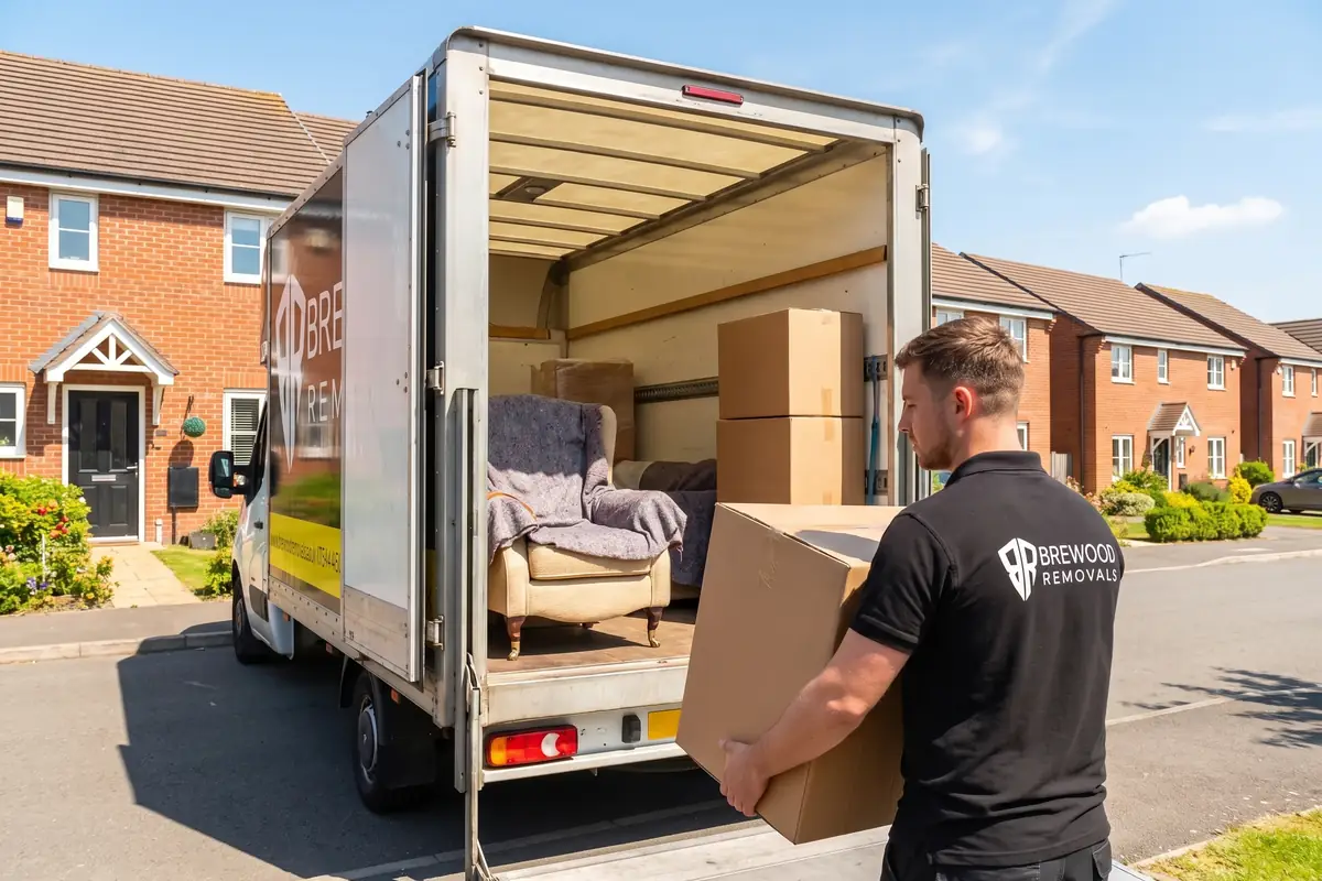 A branded Brewood Removals man-and-van being loaded with boxes in Wolverhampton